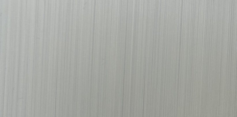 エンボスフィルムによる樹脂転写でヘアラインの質感を付与